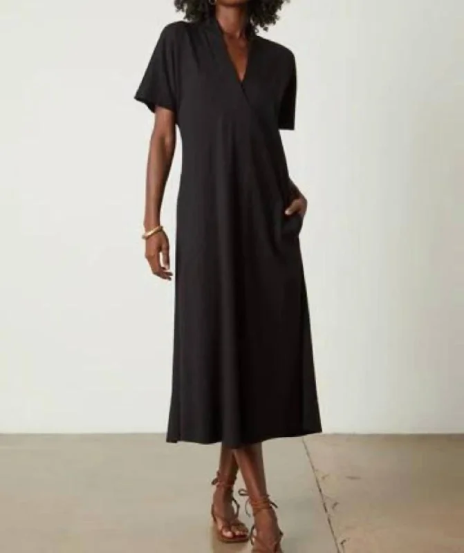 Sporty Fashion Offers Subtle Sophistication Nora Midi Dress In Black